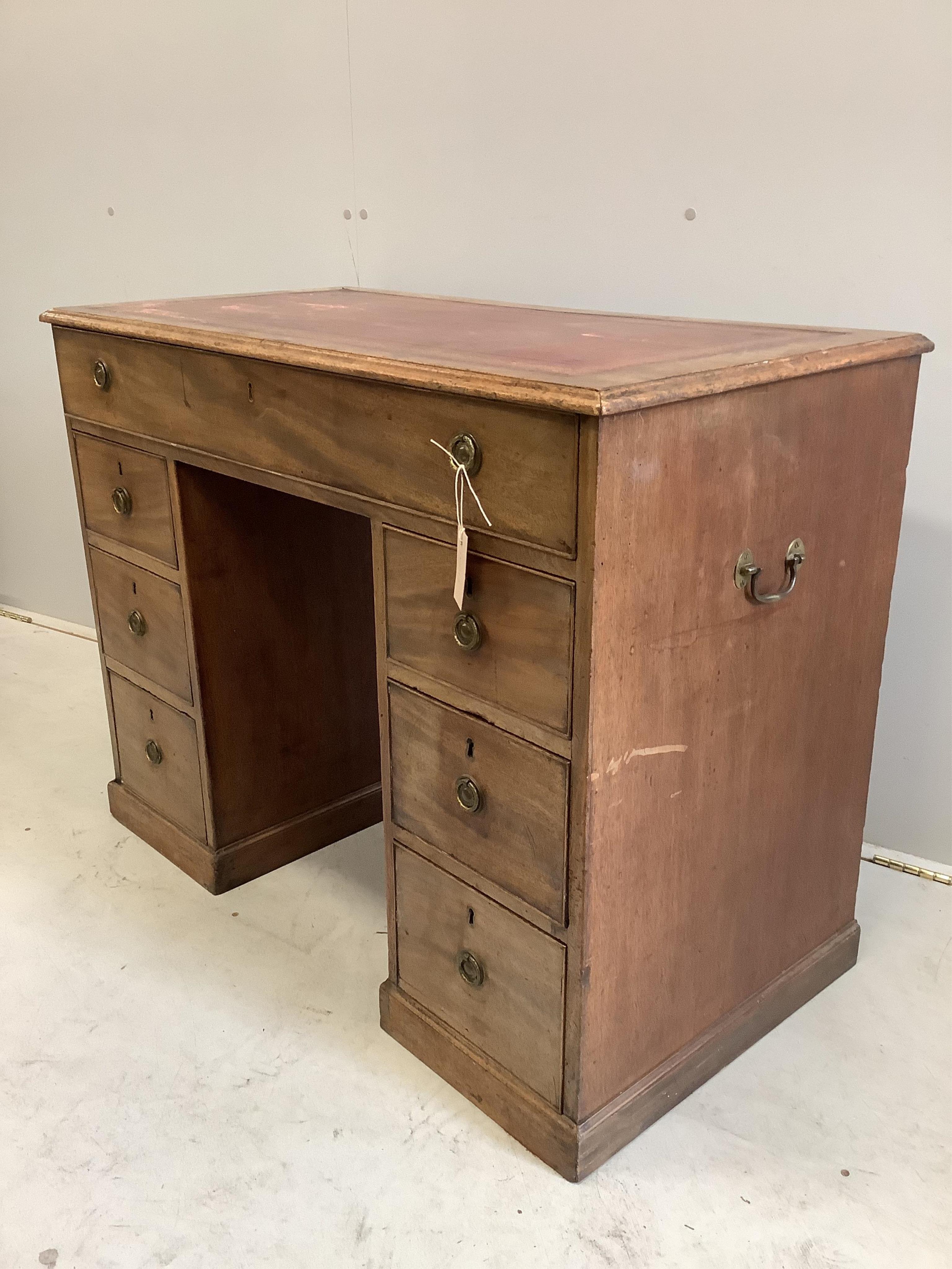 A mahogany seven drawer desk, width 102cm, depth 52cm, height 78cm